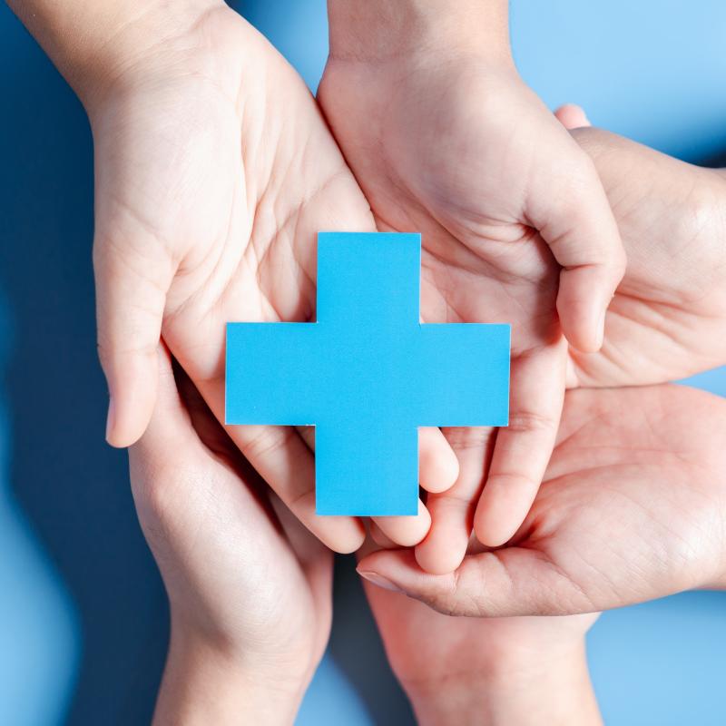 People hands holding plus and healthcare medical icon.
