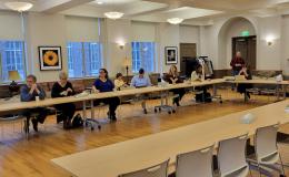 The attendees of the SSRI Open House enjoy a lively discussion about NIH-funded centers in the Henderson Living Center.