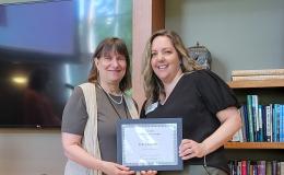 Deborah Ehrenthal, SSRI Director, and Kelly Lingenfelter, Proposal and Award Generalist for PRI, with her Innovation Award.