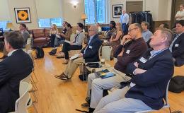 Attendees listen to research flash talks.