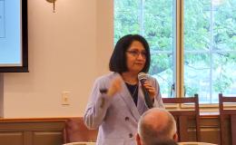 Penn State President Bendapudi talks to the group.