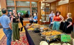 Attendees of the SSRI Spring Celebration event congregate in the Hintz Alumni Hall.