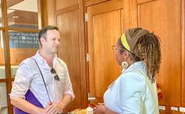 Attendees of the SSRI Spring Celebration event congregate in the Hintz Alumni Hall.