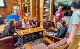 Attendees of the SSRI Spring Celebration event congregate in the Hintz Alumni Hall.