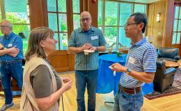 Attendees of the SSRI Spring Celebration event congregate in the Hintz Alumni Hall.