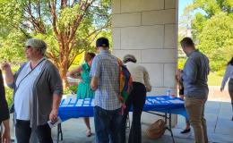 SSRI admin team welcome attendees to the SSRI Fall Welcome outside Alumni Hall.