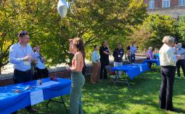 Attendees visit the various carnival-style tables to learn more about SSRI and other outside units.