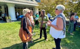 Attendees mingling at on the Alumni Hall lawn.