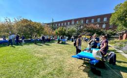 Attendees mingling at on the Alumni Hall lawn.