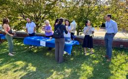Attendees mingling at on the Alumni Hall lawn.