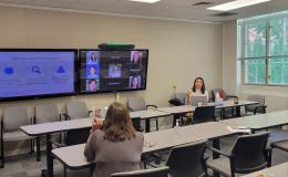 Courtney Karmelita talks to the group about research integrity.