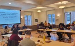 Deborah Ehrenthal, SSRI Director, welcomes attendees to the faculty flash talks open house in 110 Henderson.