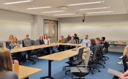 Open House attendees listen to the presentation about NIH K grants.