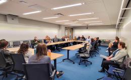 Open House attendees listen to the presentation about NIH K grants.