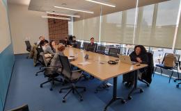 Wideshot of the attendees of the SSRI Open House looking towards the presentation in Room 314.