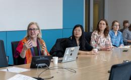 Jenny Van Hook, PRI director, talks to the group.