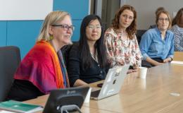 PRI Associates engage in a discussion.