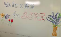 Whiteboard that says "Welcome to SSRI" on it.