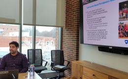 Mark Ortiz, SSRI cofunded faculty member, presents to the group.