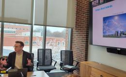 Kyle Aun, SSRI cofunded faculty member, presents to the group.