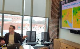 Kyle Aun, SSRI cofunded faculty member, presents to the group.