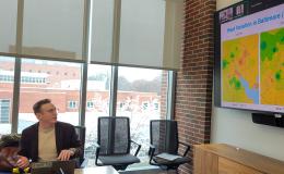 Kyle Aun, SSRI cofunded faculty member, presents to the group.