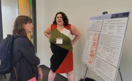 Presenters from the Poster Session show off their posters.