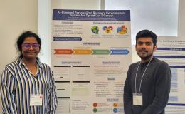 Presenters from the Poster Session show off their posters.