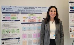 Presenters from the Poster Session show off their posters.