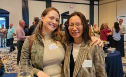 Evidence-to-Impact Collaborative staff member Sarah Hamel and Preventation Research Center staff member Yanping Zhao pose for a photo.