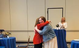 SSRI Director Deborah Ehrenthal hugs with Above and Beyond Award winner, Mindi Weidow, Project Assistant at the Survey Research Center. 