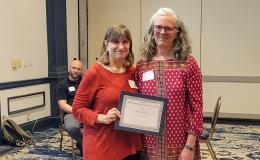 SSRI Director Deborah Ehrenthal poses with Workplace Climate winner, Diana Malcom, Senior Administrative Support at the Child Maltreatment Solutions Network.