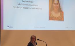Barbara Rigg, SSRI Administrative Manager, announces the winner of the Diversity and Inclusion Award, Carmen Frost, Administrative Assistant for the Population Research Institute.