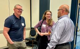 Attendees mingle and chat.