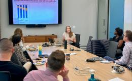 Julia Szabo, assistant professor of sociology and Latino studies, presenting about her research to the group.