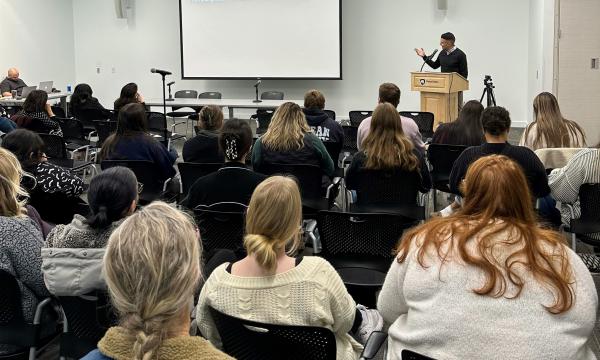Group of students and faculty attend the 31st Annual Family Symposium.