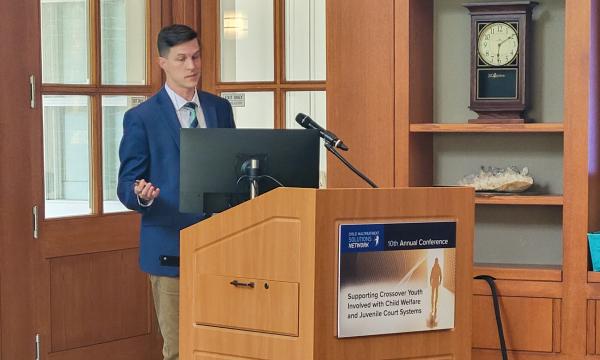 Jonathan McVey presents at the podium.