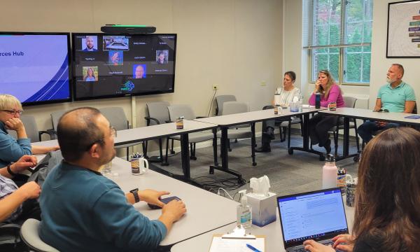 Attendees listen to a presentation about SSRI's Data Resources Hub. 