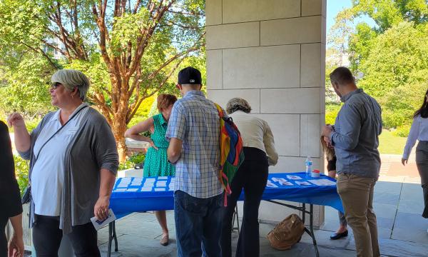 SSRI admin team welcome attendees to the SSRI Fall Welcome outside Alumni Hall.