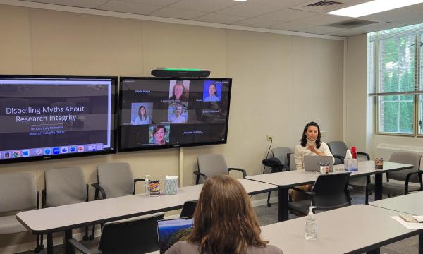 Courtney Karmelita talks to the group about research integrity.