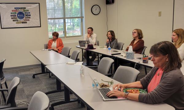 Attendees listening to Courtney Karmelita's presentation.