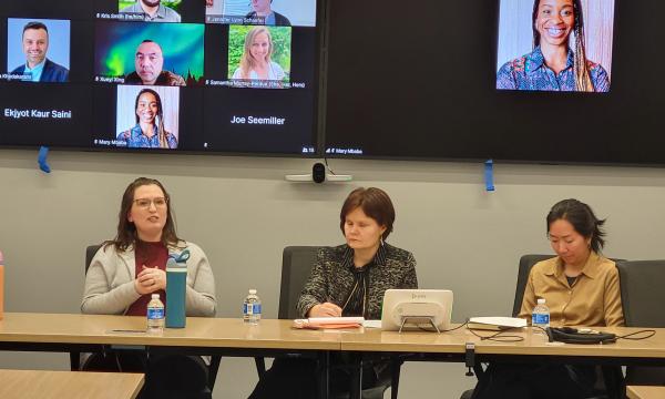 Four women, Jessica Thompson, Kathyrn Risher, Corina Graif, and Thoa Khuu, sit at a table to discuss NIH K awards.