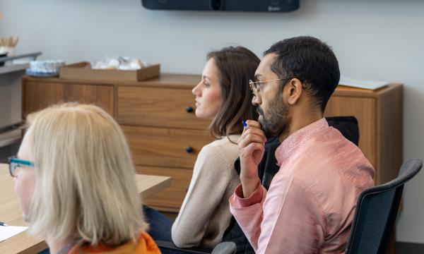 Attendees listen to a discussion.