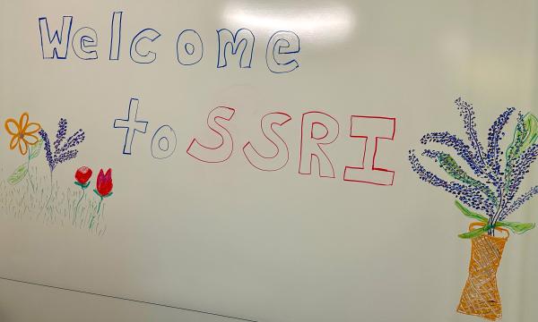 Whiteboard that says "Welcome to SSRI" on it.