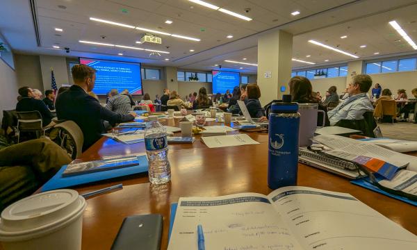 COSSA Day attendees listening to a presentation.