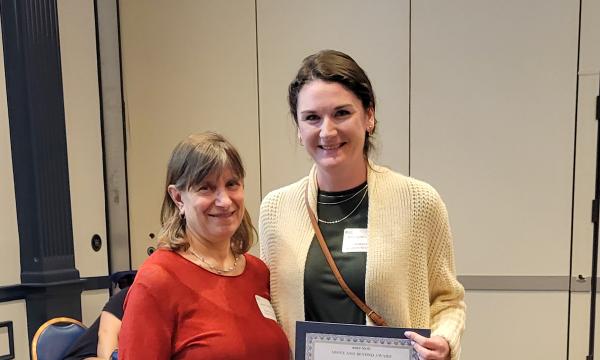 SSRI Director Deborah Ehrenthal poses with Above and Beyond Award winner, Kassidy McElwee, Project Manager for tor Child Maltreatment Solutions Network.