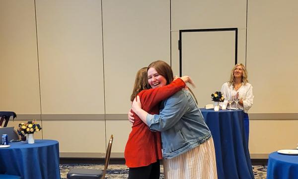 SSRI Director Deborah Ehrenthal hugs with Above and Beyond Award winner, Mindi Weidow, Project Assistant at the Survey Research Center. 