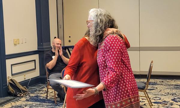 SSRI Director Deborah Ehrenthal poses with Workplace Climate winner, Senior Administrative Support at the Child Maltreatment Solutions Network.