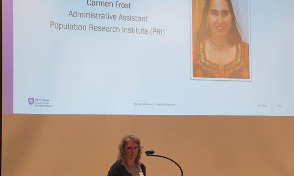 Barbara Rigg, SSRI Administrative Manager, announces the winner of the Diversity and Inclusion Award, Carmen Frost, Administrative Assistant for the Population Research Institute.