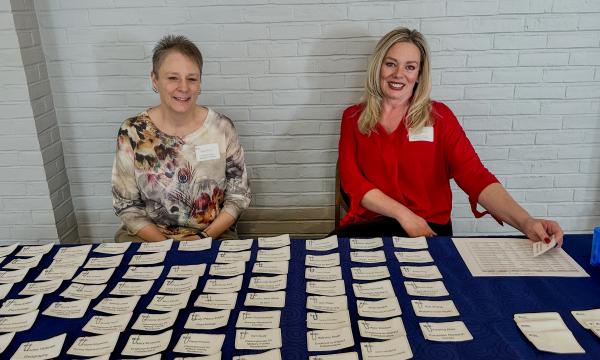 SSRI administrative staff Deanna Lose and Robin Dickson work the registration table.